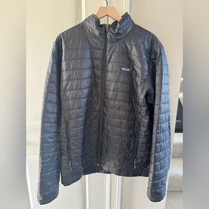 Patagonia Men’s Nano Puff jacket.  Barely worn as it is too big for me.